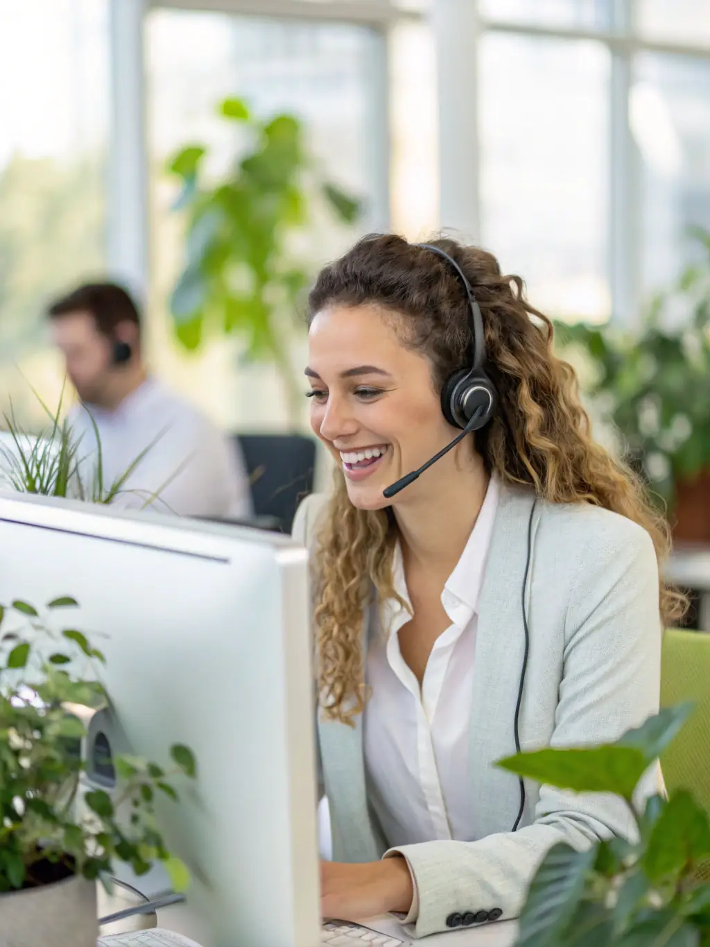 A customer service representative assisting a customer via video call, highlighting the personalized support offered by C24.